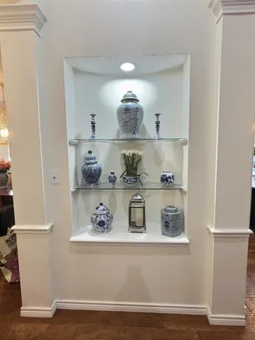 a view of kitchen island with cabinets and wooden floor