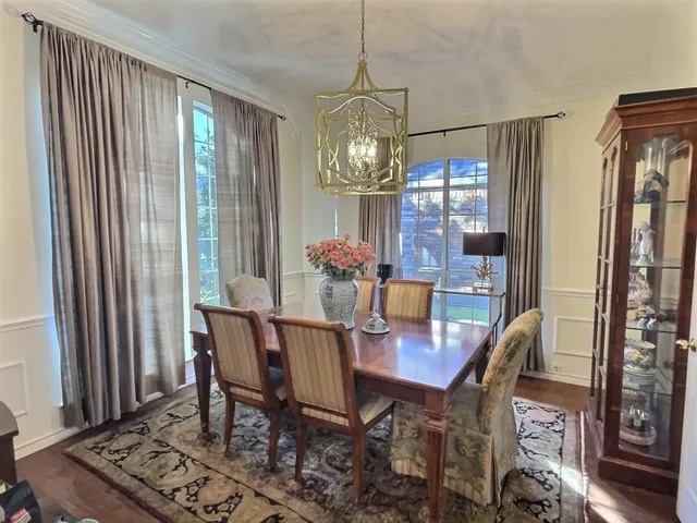 a view of a dining room with furniture and window
