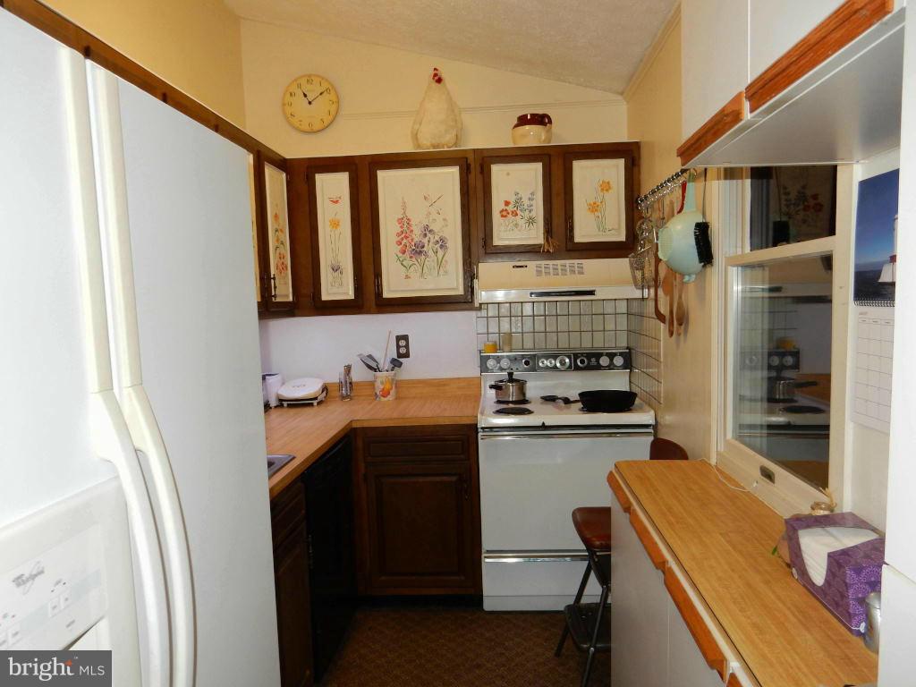 105 Haverhill Road Joppa, MD 21085 - Photo 5 of 21 a room with a sink a washer and dryer