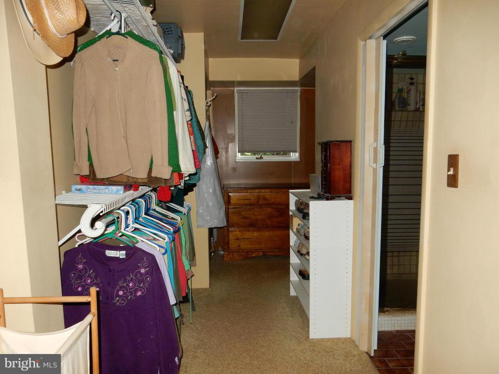105 Haverhill Road Joppa, MD 21085 - Photo 7 of 21 a view of walk in closet with clothes and shoes
