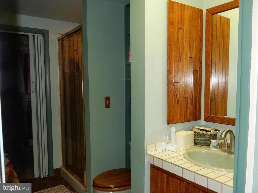 105 Haverhill Road Joppa, MD 21085 - Photo 8 of 21 a bathroom with a granite countertop sink and a mirror