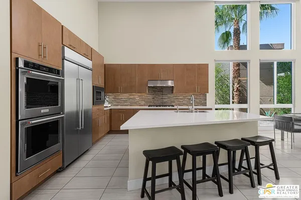 a stove top oven sitting inside of a kitchen