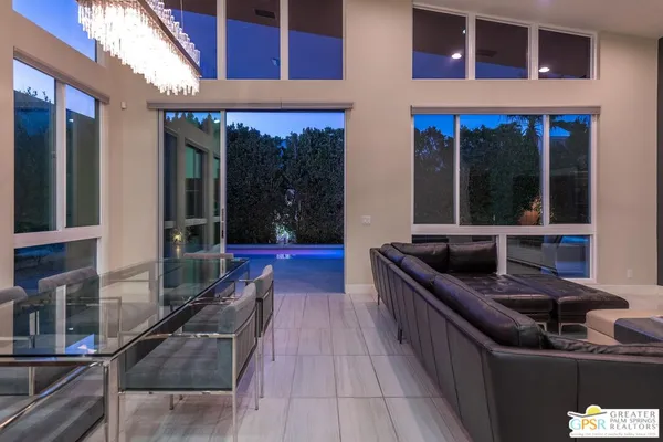 a view of swimming pool with outdoor seating