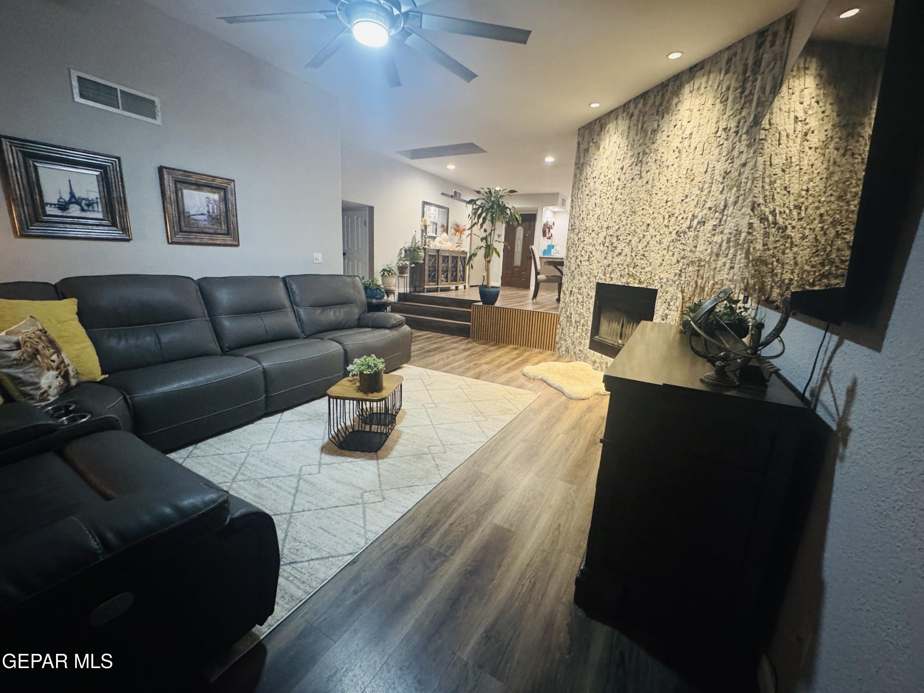 4621 Esparza Lane El Paso, TX 79934 - Photo 11 of 24 a living room with furniture and a fireplace