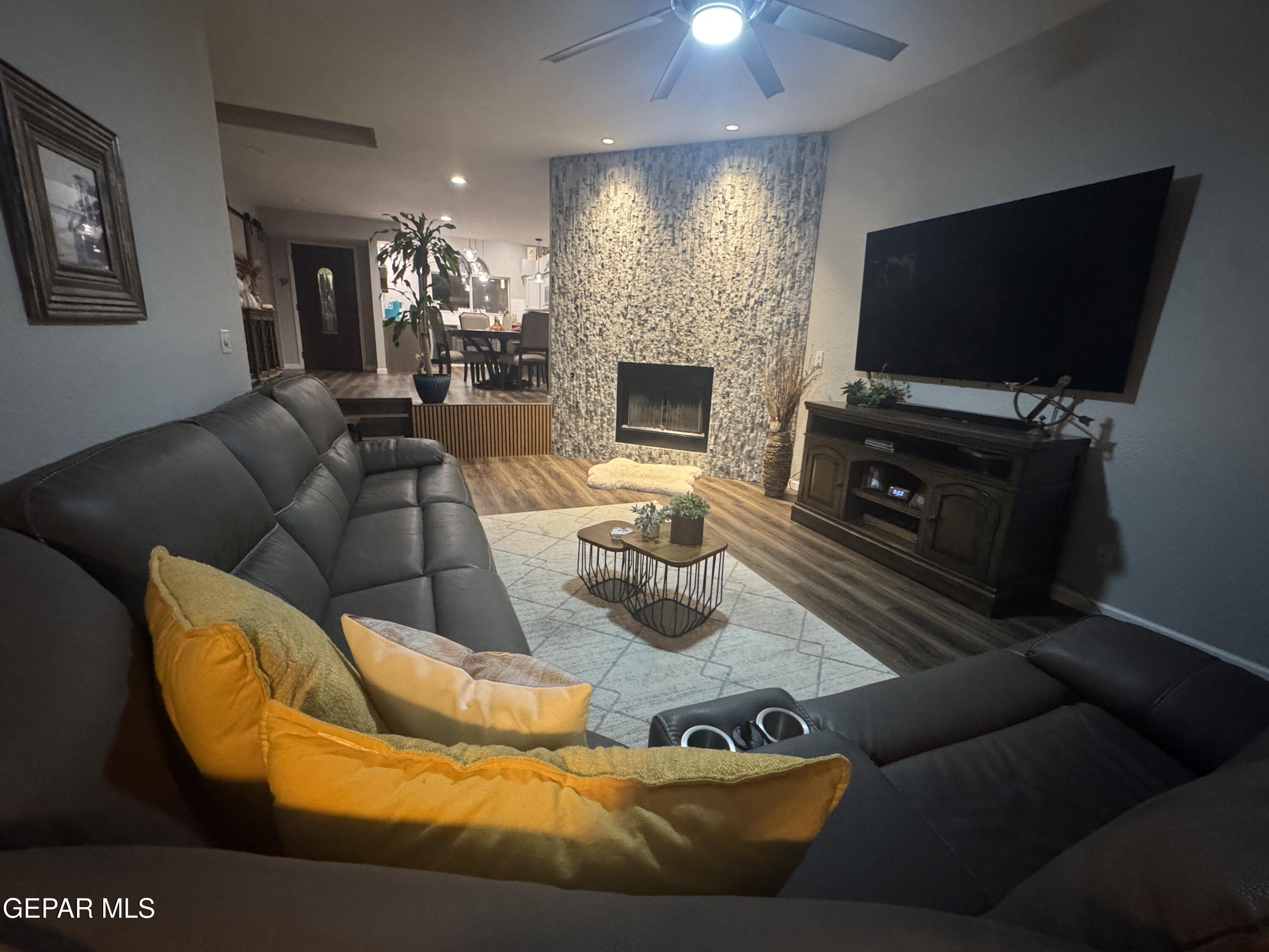 4621 Esparza Lane El Paso, TX 79934 - Photo 12 of 24 a living room with furniture and a flat screen tv