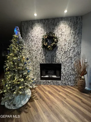 a room with a fireplace and a potted plant