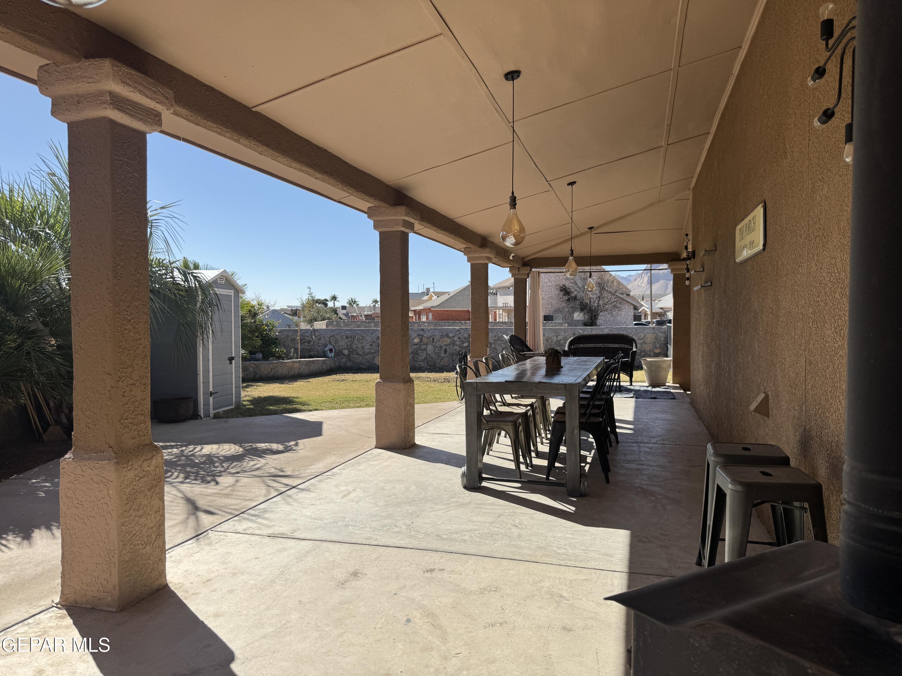 4621 Esparza Lane El Paso, TX 79934 - Photo 21 of 24 a view of a patio with a dining table and chairs