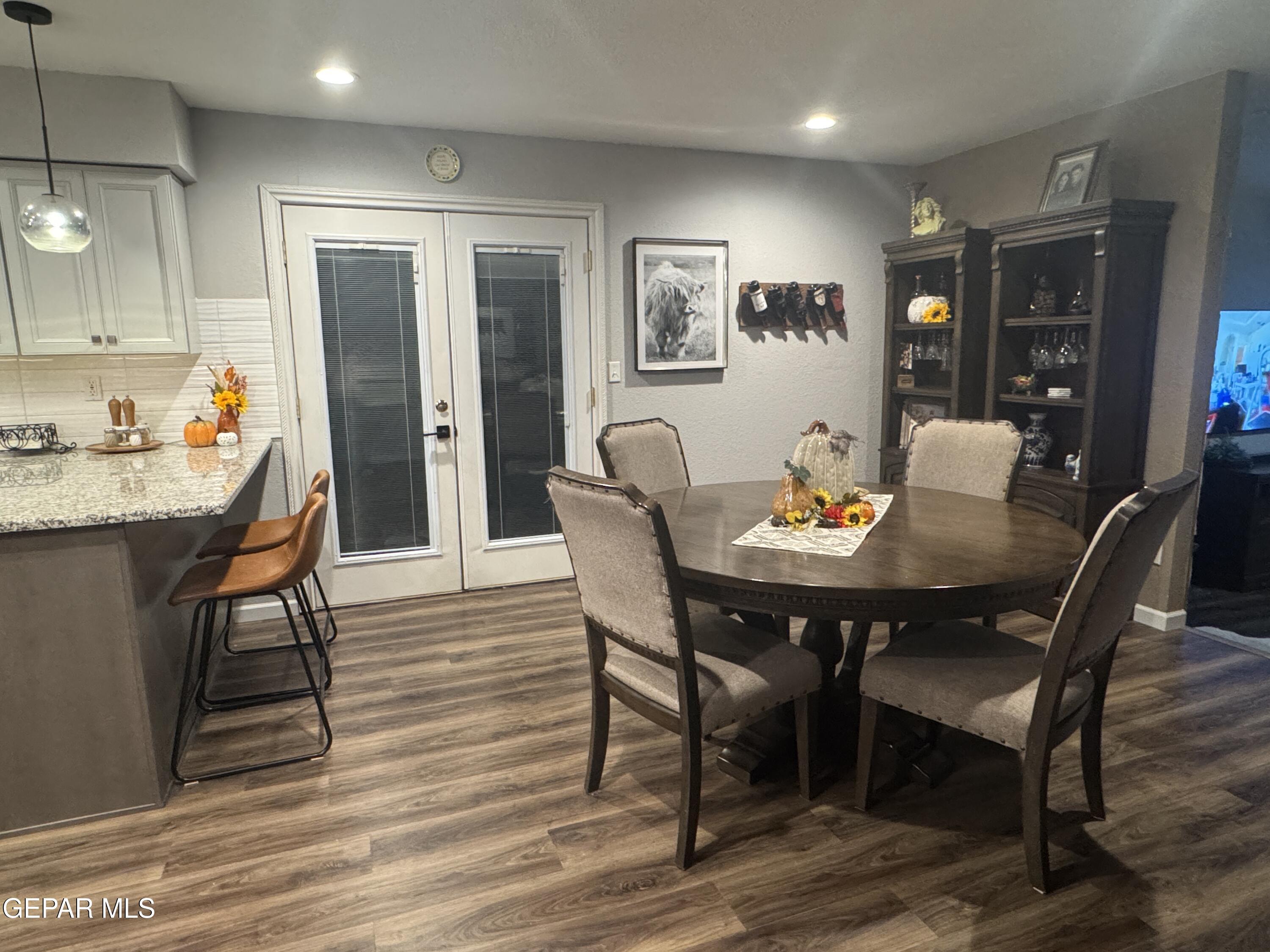 4621 Esparza Lane El Paso, TX 79934 - Photo 8 of 24 a view of a dining room with furniture and wooden floor