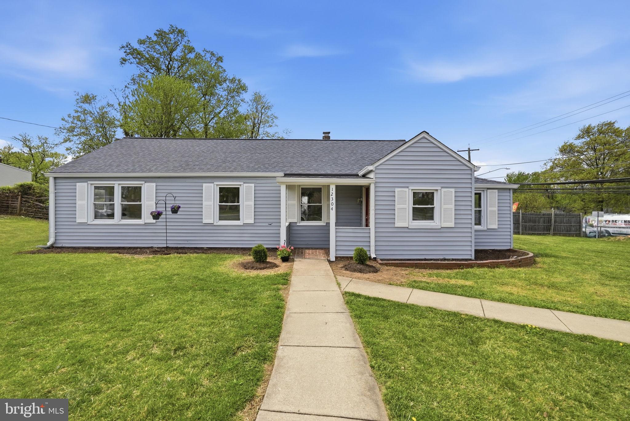 12304 Livingston Street Silver Spring, MD 20902 - Photo 2 of 20 a front view of a house with a yard