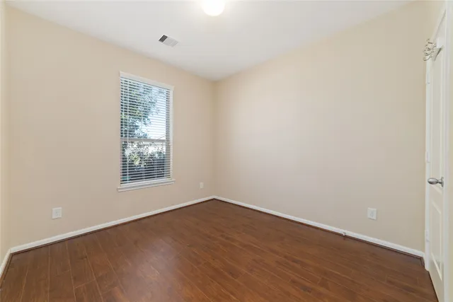 a bathroom with a bathtub shower sink mirror vanity and toilet