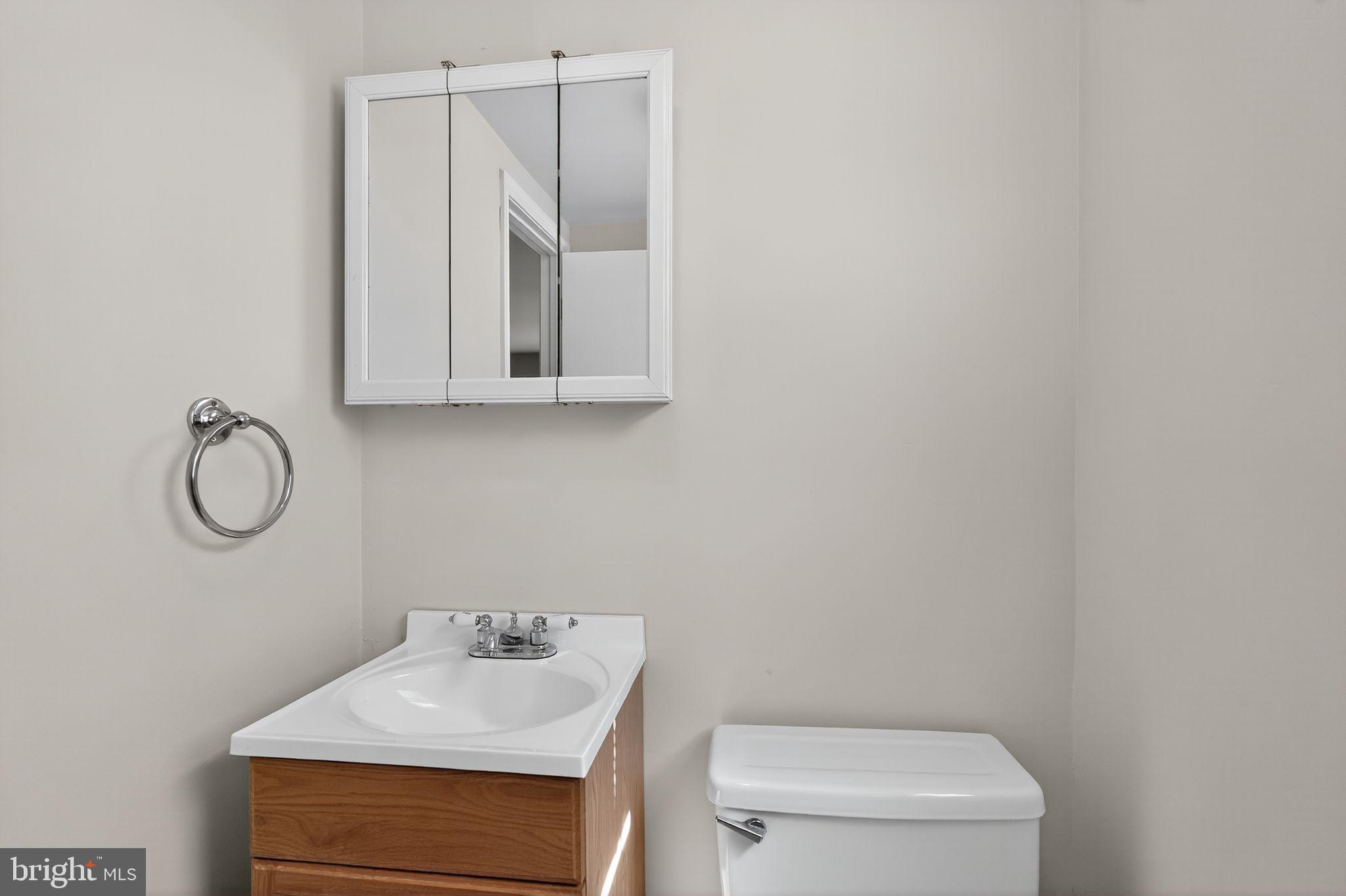 533 Crotzer Avenue Folcroft, PA 19032 - Photo 21 of 30 a bathroom with a sink a toilet and mirror