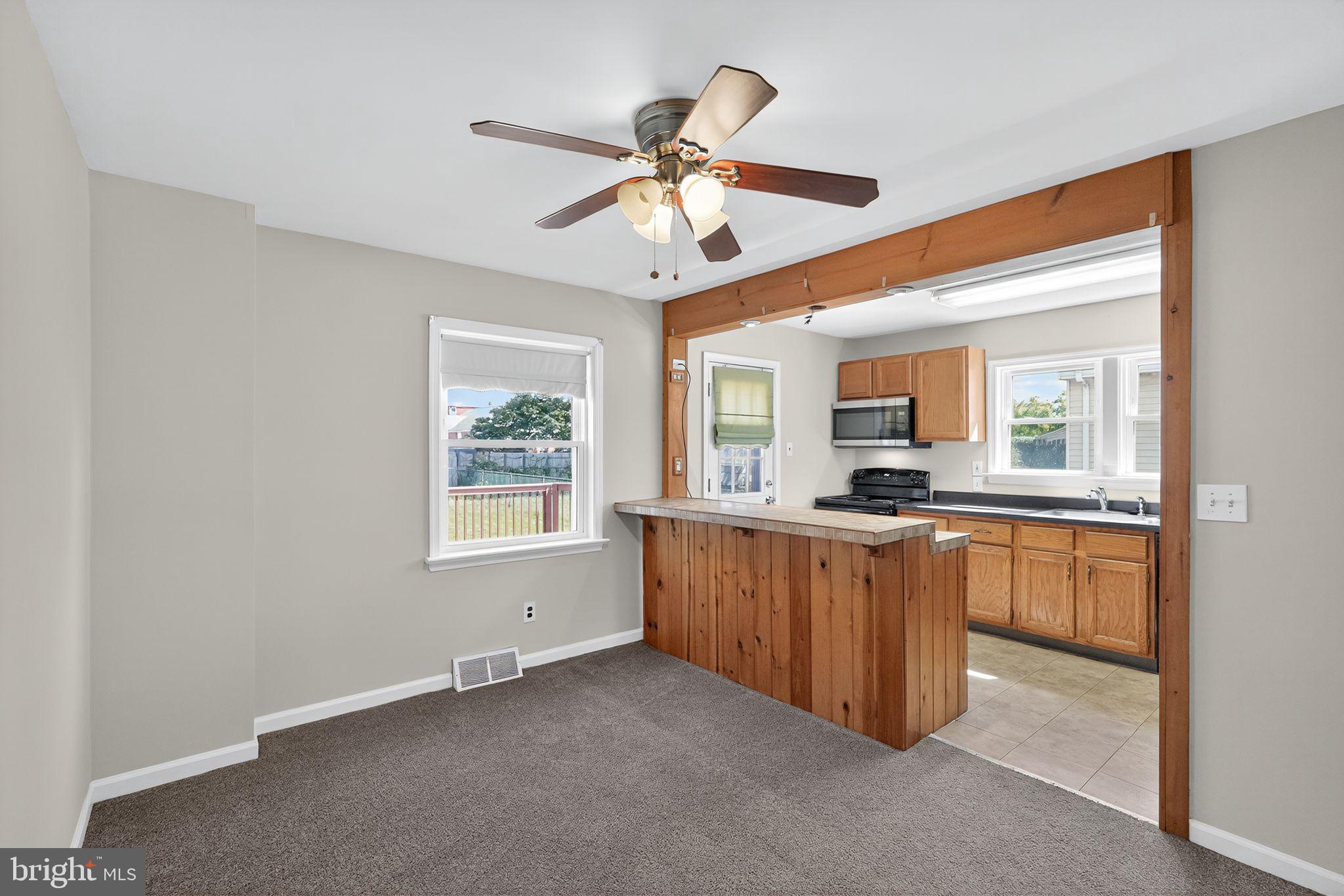 533 Crotzer Avenue Folcroft, PA 19032 - Photo 10 of 30 a open kitchen with granite countertop a sink and white cabinets