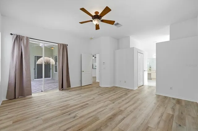a view of livingroom with hardwood floor and a ceiling fan