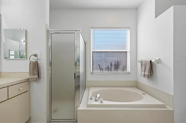 a white bath tub sitting next to a window