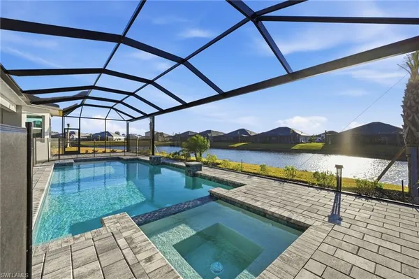 a view of swimming pool with seating area