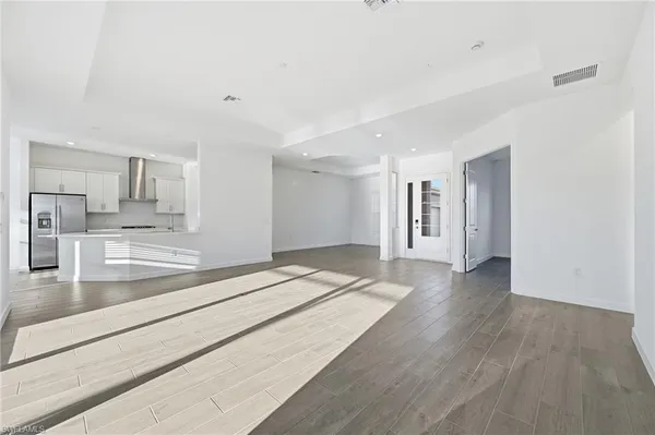 a view of a kitchen with a sink and cabinets