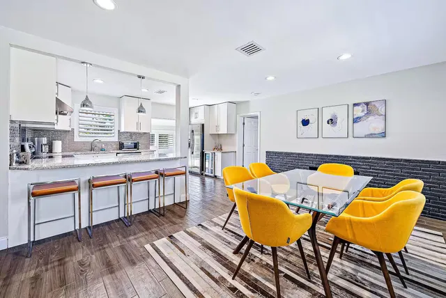 a kitchen with granite countertop a sink and cabinets