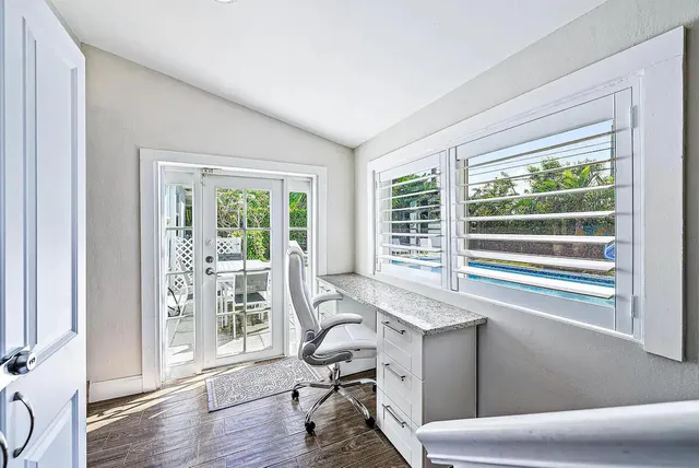 a bathroom with a bath tub sink shower and mirror