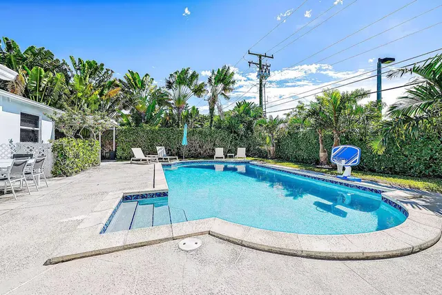 a view of a swimming pool with a patio