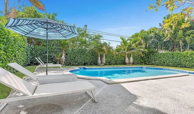 a view of a swimming pool with a patio