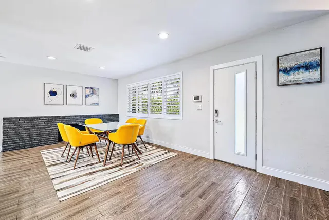 a blue chair sitting next to a window