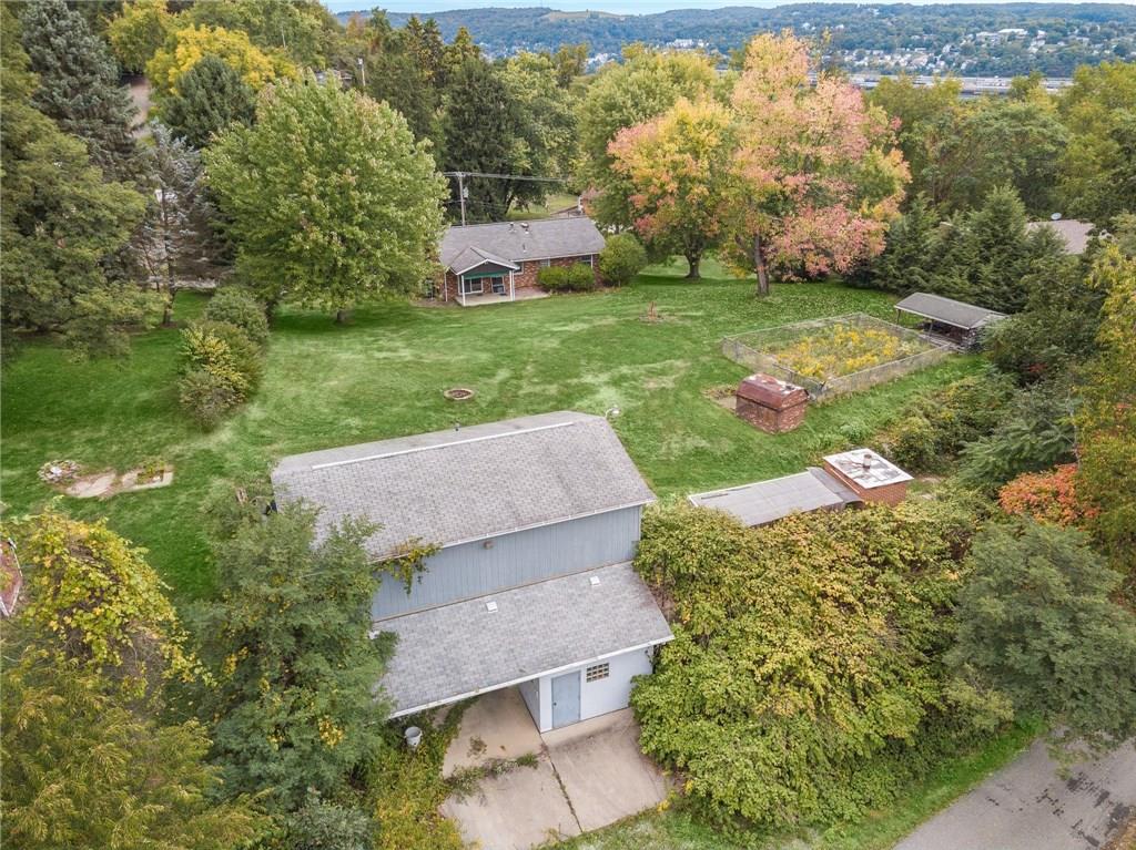 1020 Monaca Road Monaca, PA 15061 - Photo 22 of 25 Aerial view of the outbuilding...brick meat cooker...smoke house...covered pavilion...fenced garden...yes, this back yard offers ALL OF THAT, plus plenty of extra space!