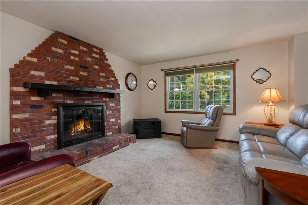 1020 Monaca Road Monaca, PA 15061 - Photo 4 of 25 Living Room offers a large, wood burning fireplace.