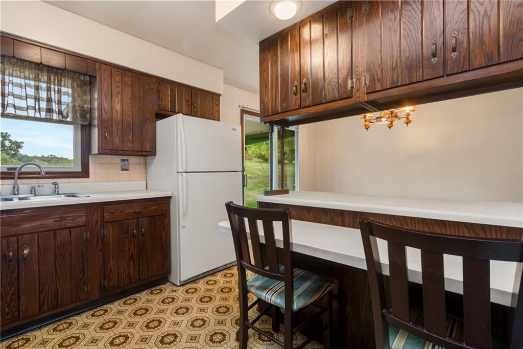 1020 Monaca Road Monaca, PA 15061 - Photo 6 of 25 Breakfast bar overlooks the Dining Room... perfect spot for quick meals or doing homework!