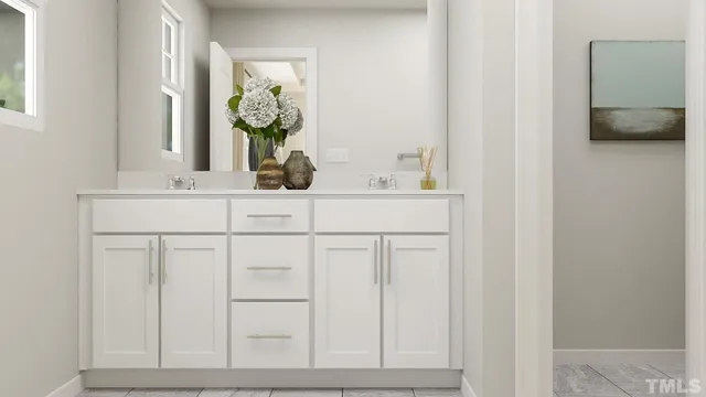 a bedroom with a bed and a lamp