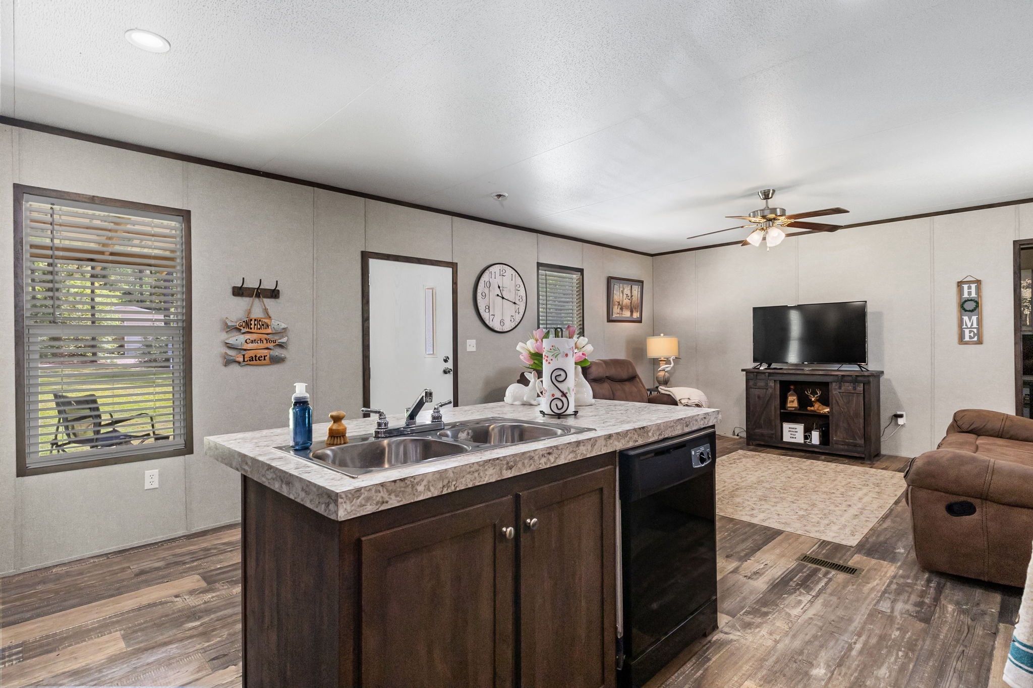 275 Bryan Street Zavalla, TX 75980 - Photo 11 of 24 a living room with granite countertop furniture and a flat screen tv