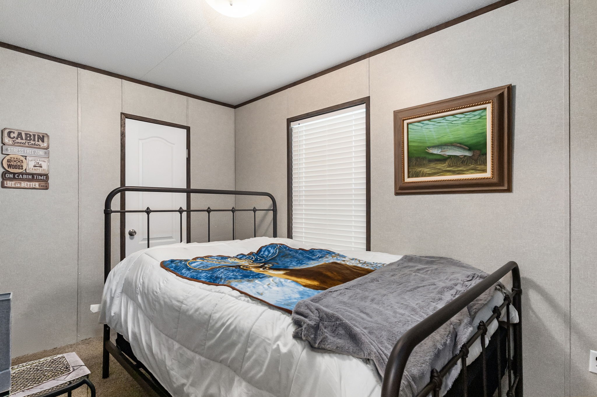 275 Bryan Street Zavalla, TX 75980 - Photo 15 of 24 a bedroom with a bed and a window