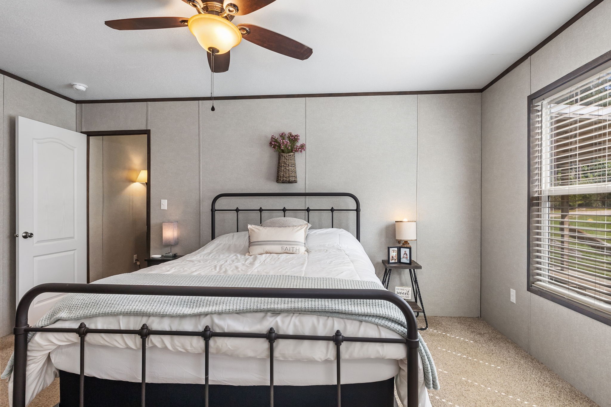 275 Bryan Street Zavalla, TX 75980 - Photo 17 of 24 a bedroom with a bed and window