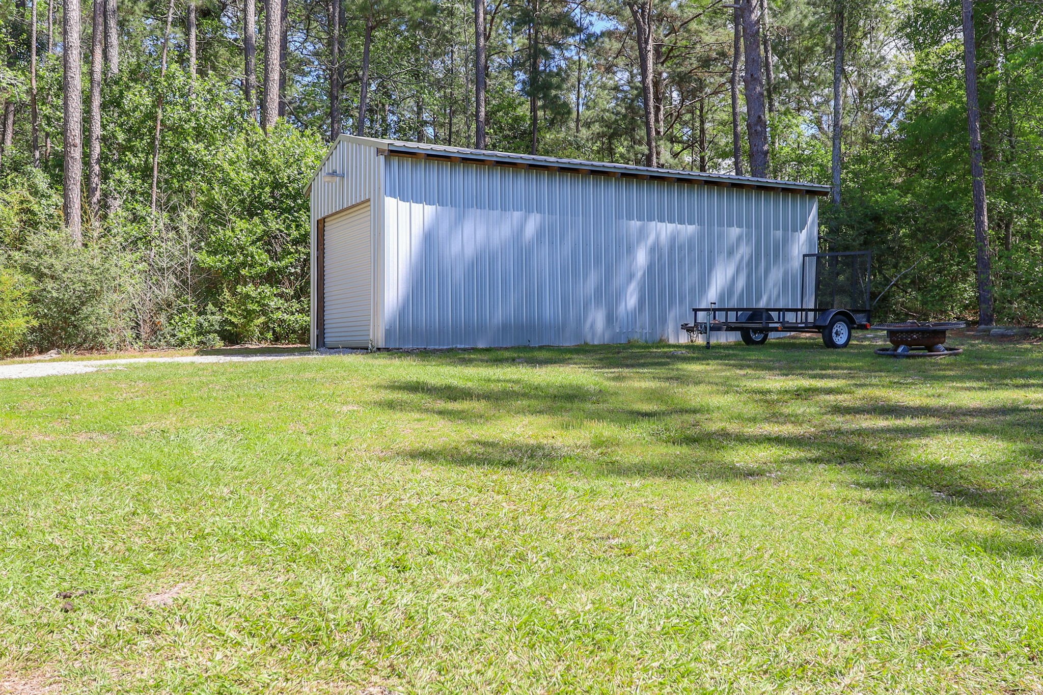 275 Bryan Street Zavalla, TX 75980 - Photo 19 of 24 a view of a back yard of the house