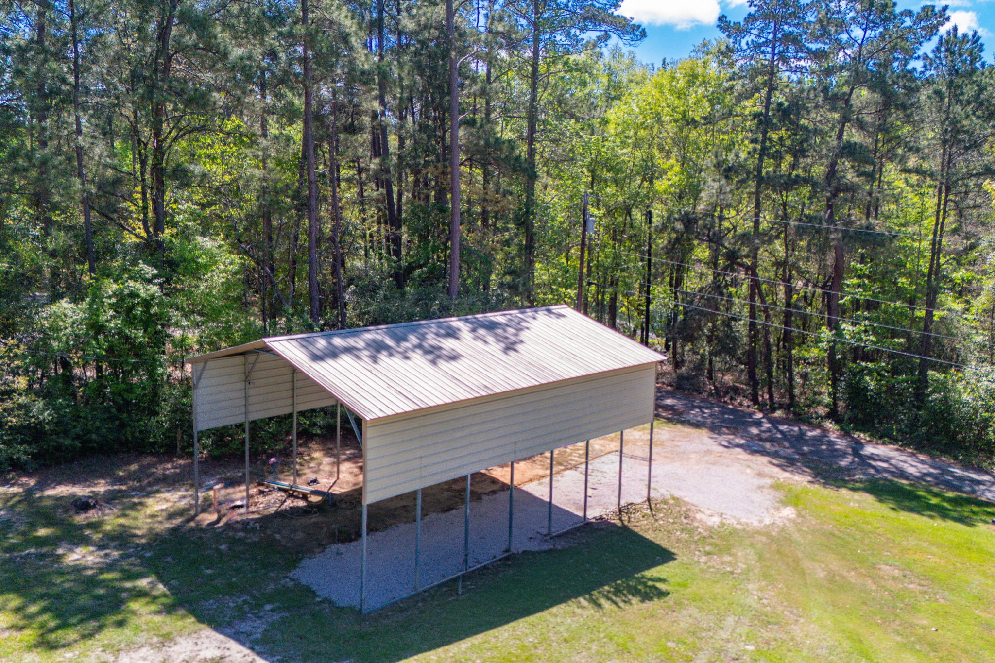 275 Bryan Street Zavalla, TX 75980 - Photo 23 of 24 aerial view of a house with roof deck front of house