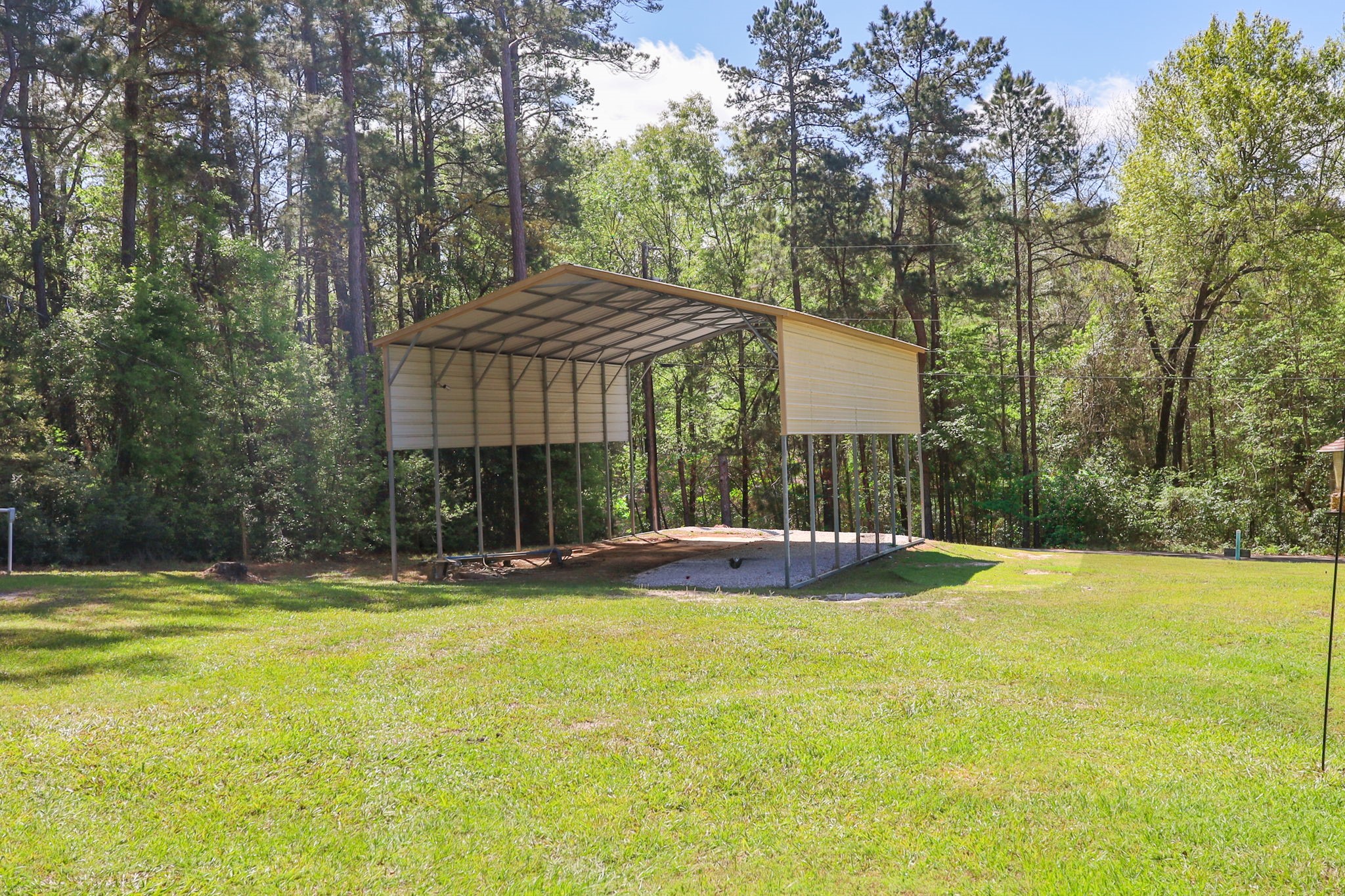 275 Bryan Street Zavalla, TX 75980 - Photo 24 of 24 a view of pool with a yard and large trees