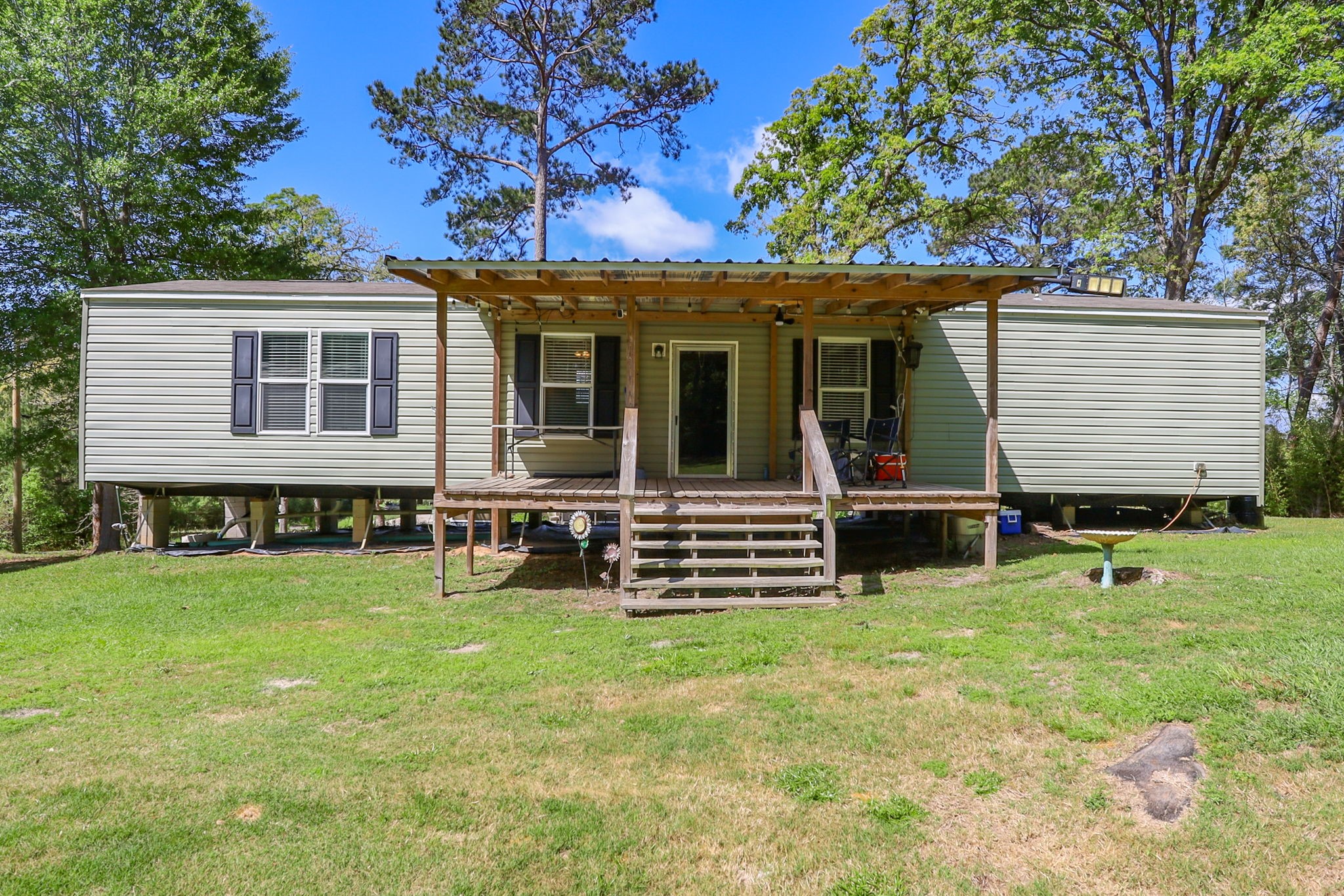 275 Bryan Street Zavalla, TX 75980 - Photo 4 of 24 a view of a house with a yard