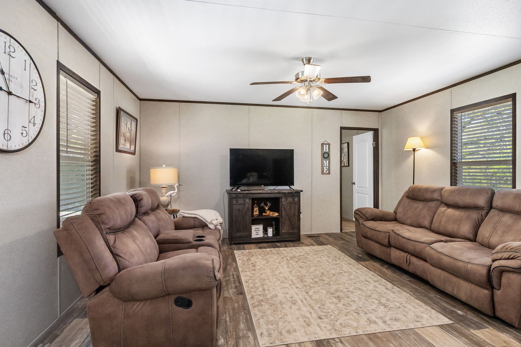 275 Bryan Street Zavalla, TX 75980 - Photo 6 of 24 a living room with furniture and a flat screen tv