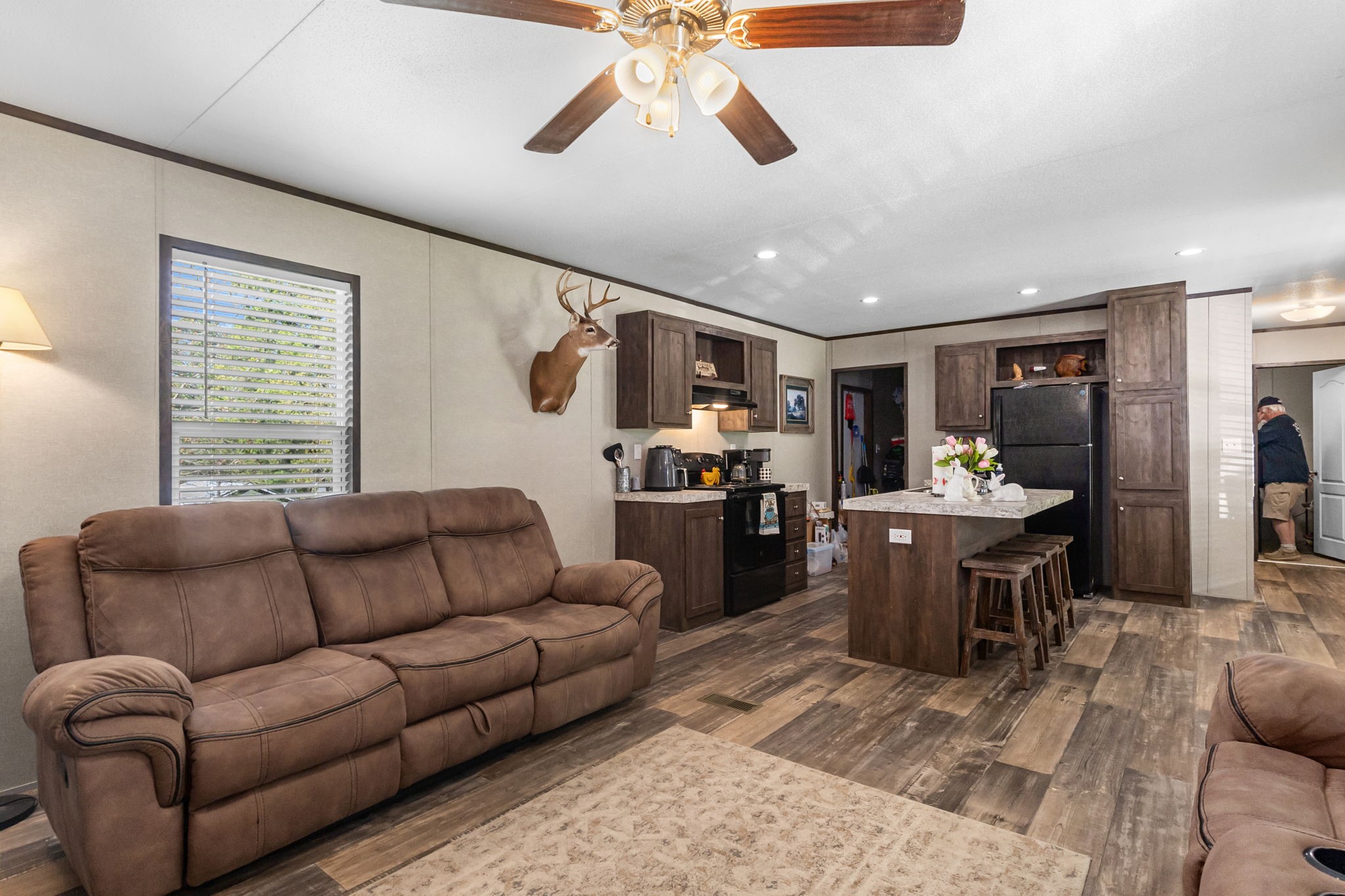 275 Bryan Street Zavalla, TX 75980 - Photo 7 of 24 a living room with furniture kitchen view and a window