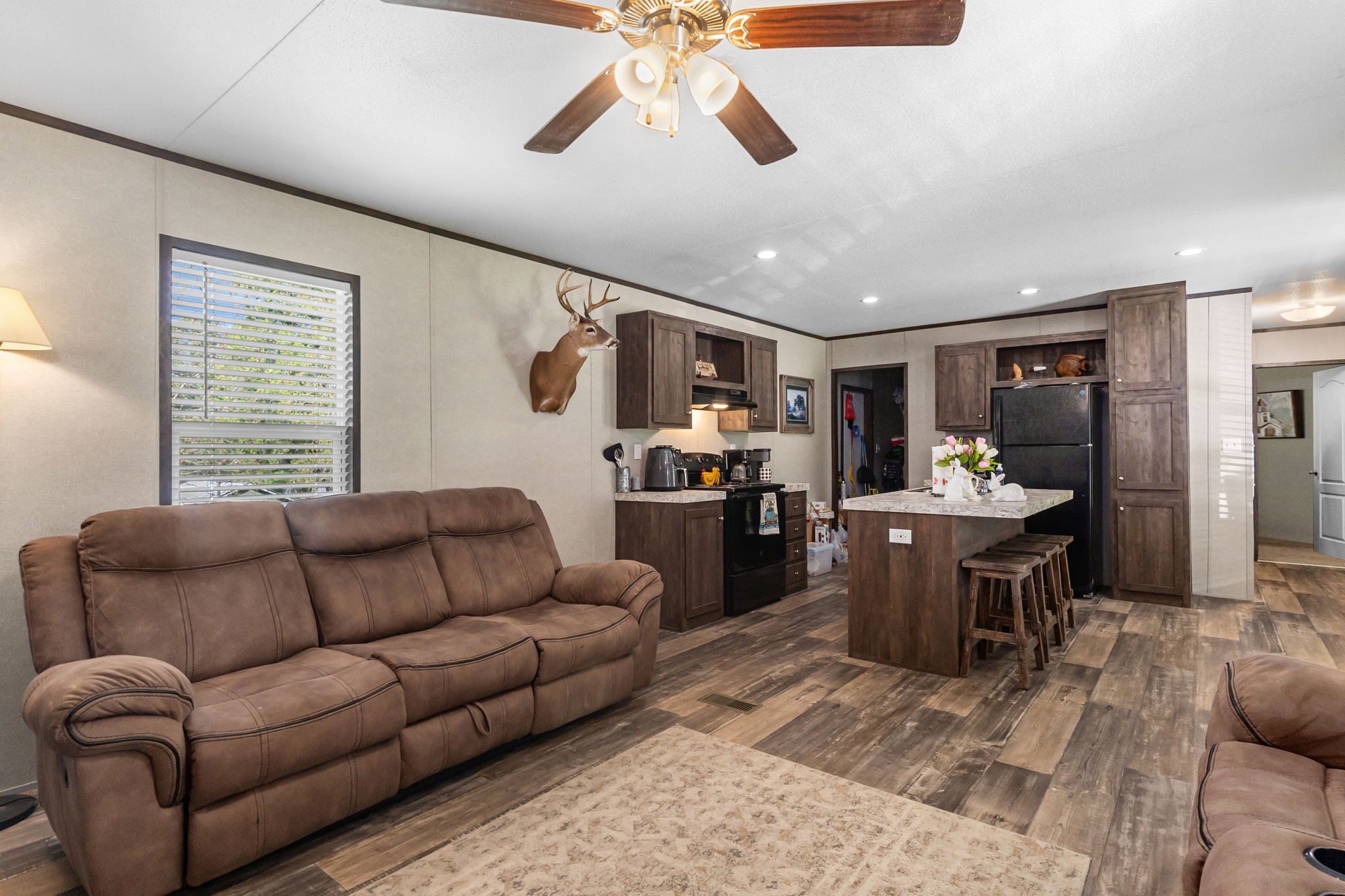 275 Bryan Street Zavalla, TX 75980 - Photo 8 of 24 a living room with furniture kitchen view and a window
