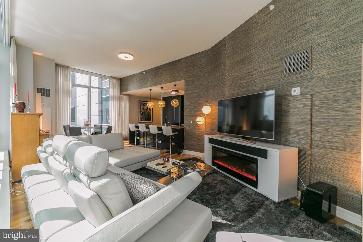 1414 South Penn Square, Unit 45A Philadelphia, PA 19102 - Photo 13 of 23 a living room with furniture and a flat screen tv