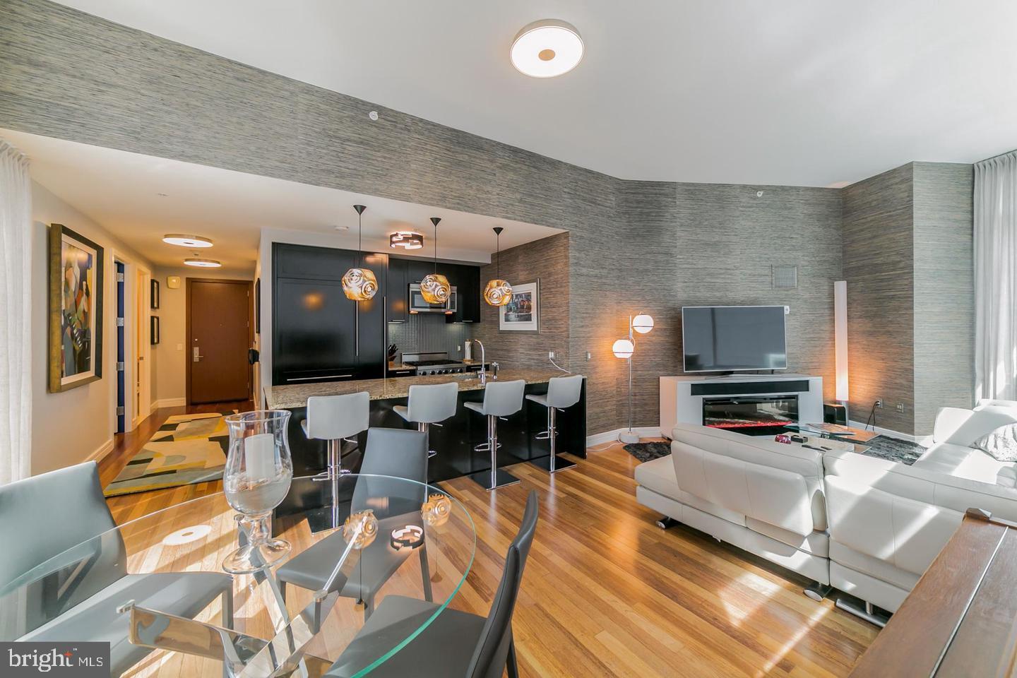 1414 South Penn Square, Unit 45A Philadelphia, PA 19102 - Photo 15 of 23 a living room with furniture and a flat screen tv