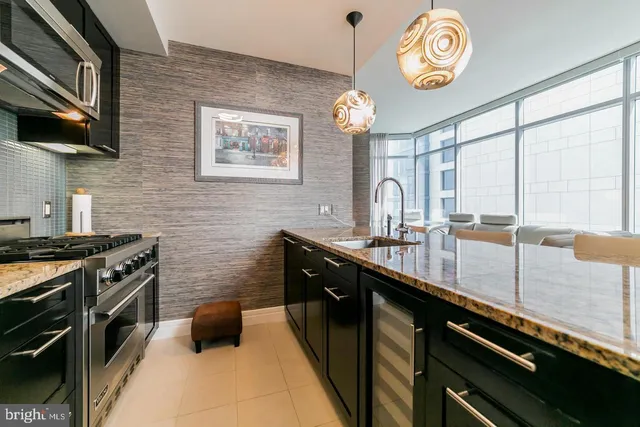 a kitchen with a stove and a refrigerator