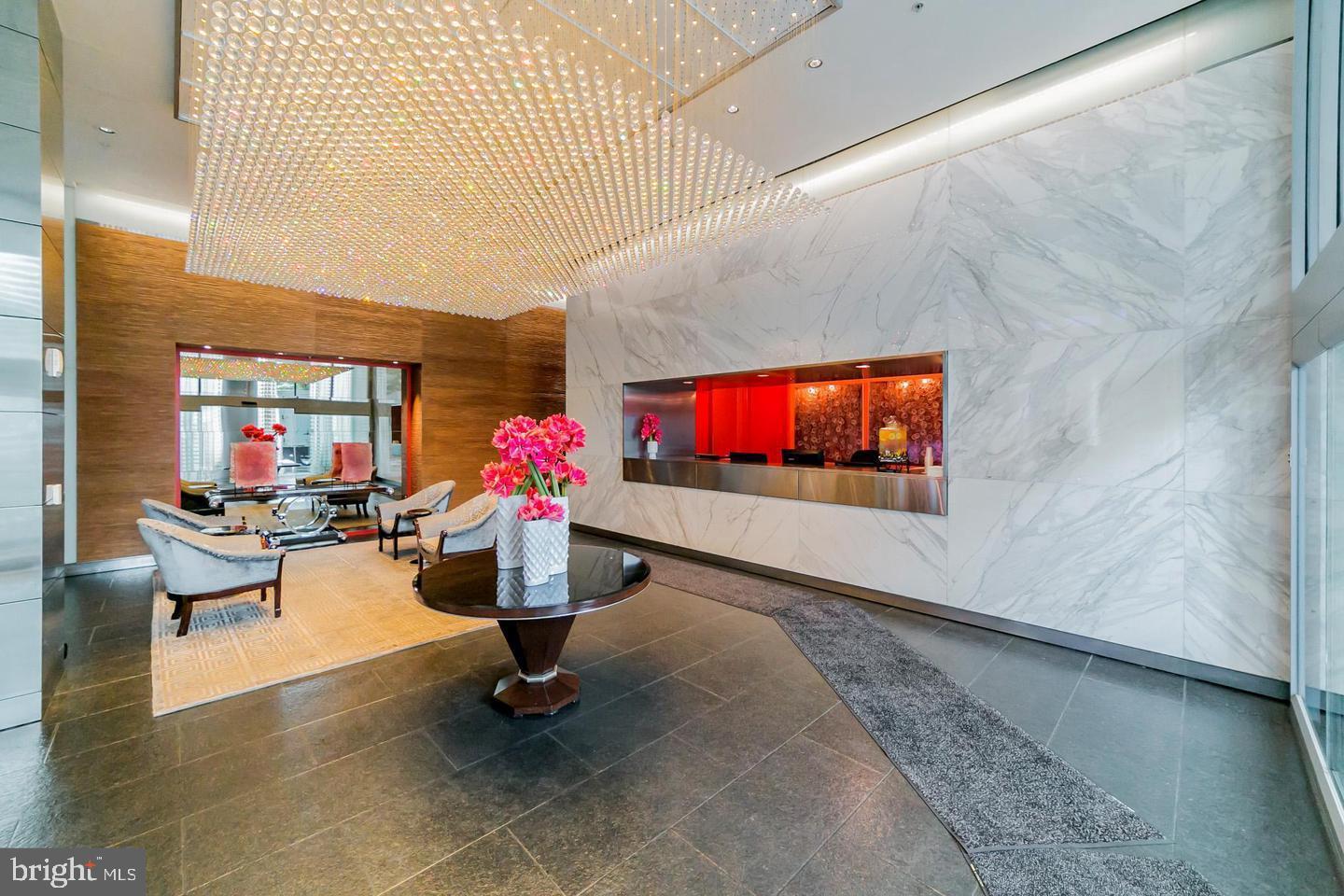 1414 South Penn Square, Unit 45A Philadelphia, PA 19102 - Photo 2 of 23 a living room with furniture and a flat screen tv