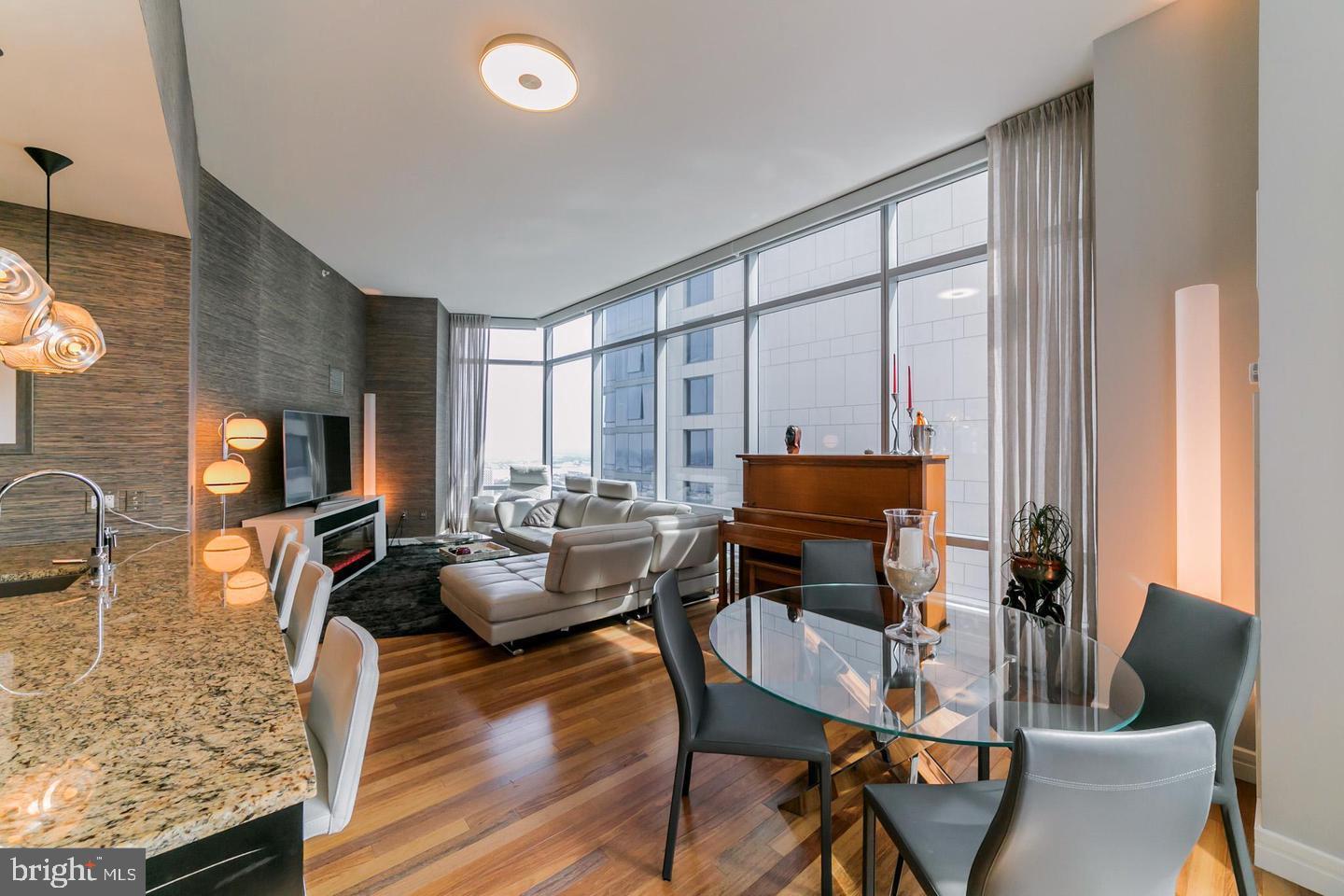 1414 South Penn Square, Unit 45A Philadelphia, PA 19102 - Photo 10 of 23 a living room with furniture and a flat screen tv