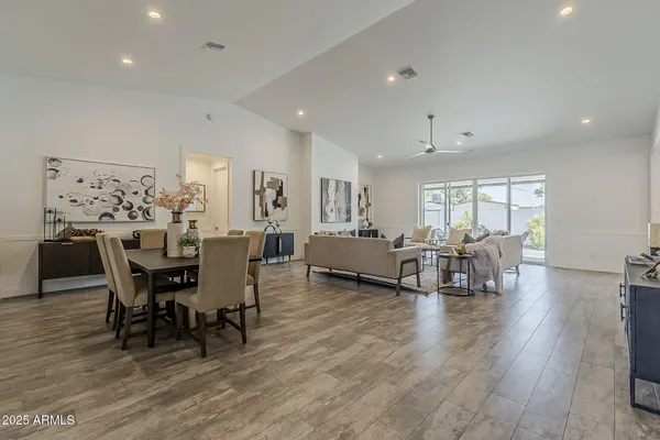 a view of a dining room with furniture and wooden floor