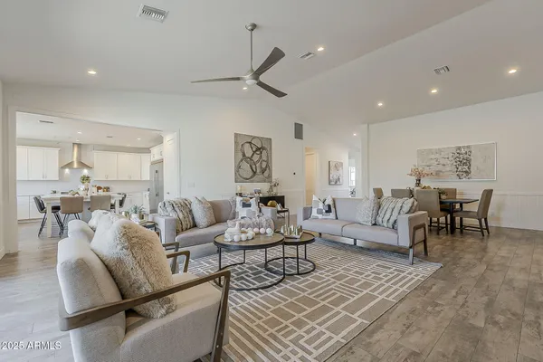 a spacious bathroom with double sink and a mirror