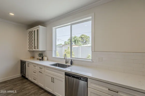 a view of an outdoor dining space with a table and chairs