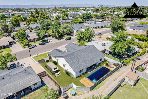 an aerial view of house with yard