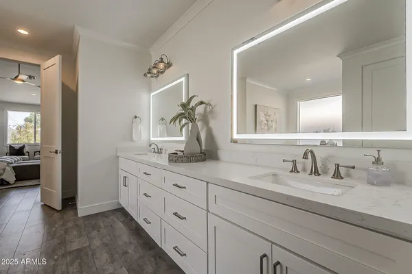 an aerial view of a house with swimming pool and ocean view