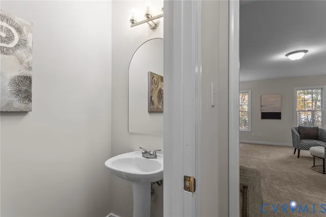 a bathroom with a sink and mirror